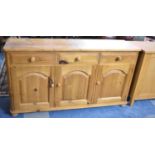 A Pine Sideboard with Three Short Drawers Over Cupboard Base, 152cm Wide