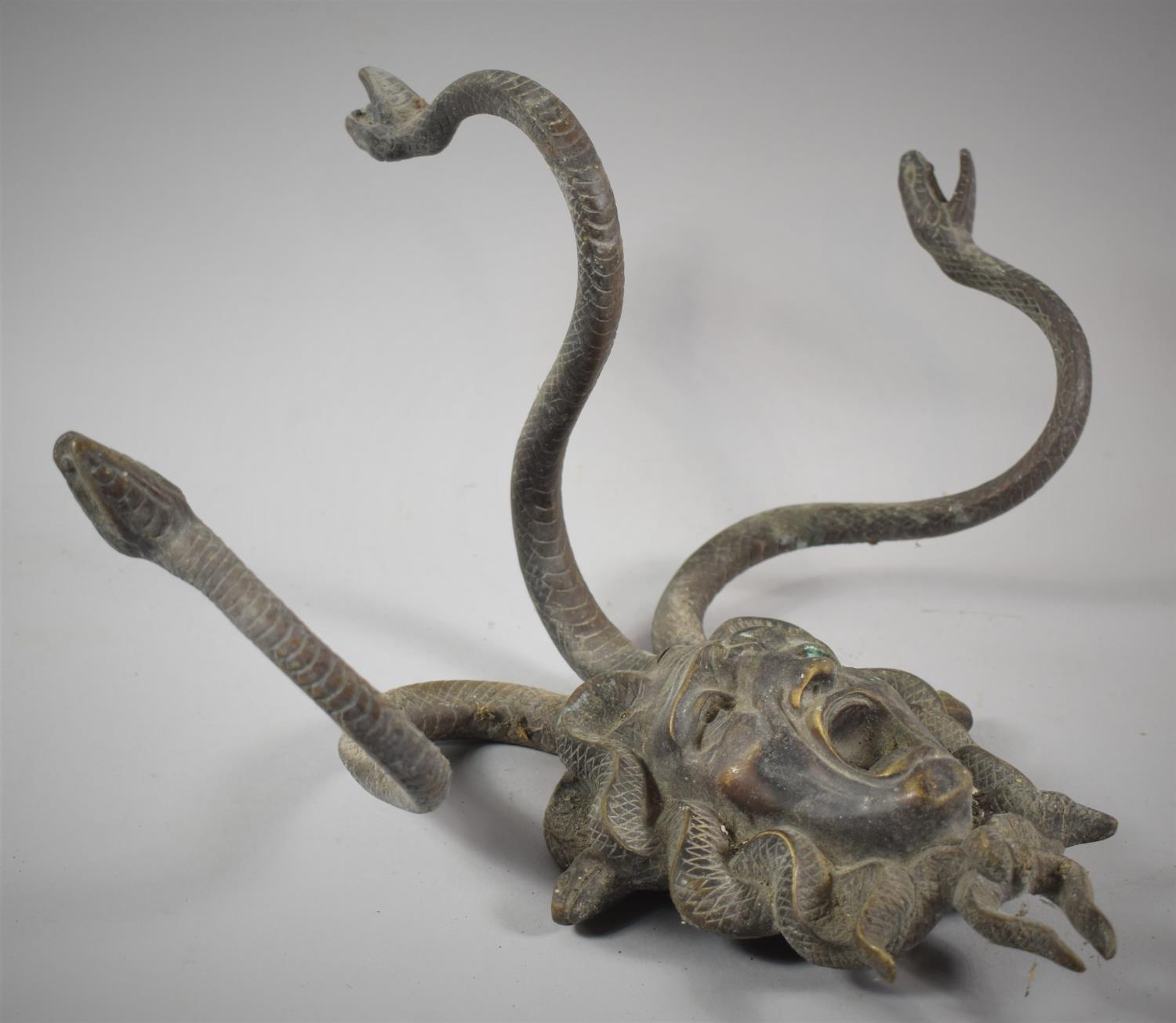 A Modern Cast Metal Bronze Effect Wall Hanging or Coat Rack in the Form of Medusa's Head with