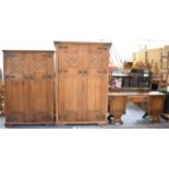 A Mid 20th Century Oak Linen Fold Three Piece Bedroom Suite Comprising Gents and Ladies Wardrobes