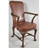 An Edwardian Oak Framed Studded Leather Upholstered Armchair with Cabriole Front Legs