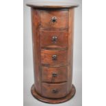 A Cylindrical Indonesian Hardwood Chest of Five Short Drawers, 75cm high