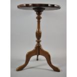 A Reproduction Walnut Pie Crust Topped Tripod Wine Table, 35cm Diameter and 51cm High