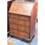 A Mid 20th Century Walnut Fall Front Bureau with Four Graduated Drawers to Base on Bracket Feet,