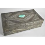 A Rectangular Pewter Covered Wooden Box with Ceramic and Green Glass Cabochons and Relief