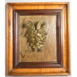 A Nicely Moulded Gilt Metal Devils Mask Mounted in Rectangular Wooden Frame, Frame 24x21cm