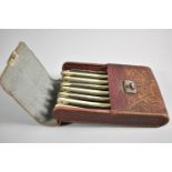 An Edwardian Leather Cased Set of Seven "Extra Hollow Ground" Cut Throat Razors, Each Engraved