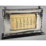 A Silver Mounted Desktop Calendar on Wooden Plinth Base, 21cm Wide