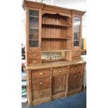 A Late Victorian Pitch Pine Kitchen Dresser, the Base with Three Short Drawers Over Centre