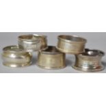 A Collection of Five Various Silver Napkin Rings