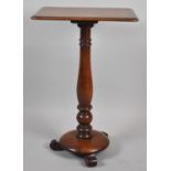 A Victorian Rectangular Topped Occasional Table on Turned Support with Three Scrolled Feet