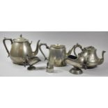 A Collection of Pewter to Include Teapots, Helmet Shaped Sugar Bowls and Napkin Rings
