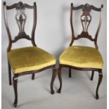 A Pair of Edwardian Mahogany Side Chairs with Pierced Splats and Serpentine Fronts