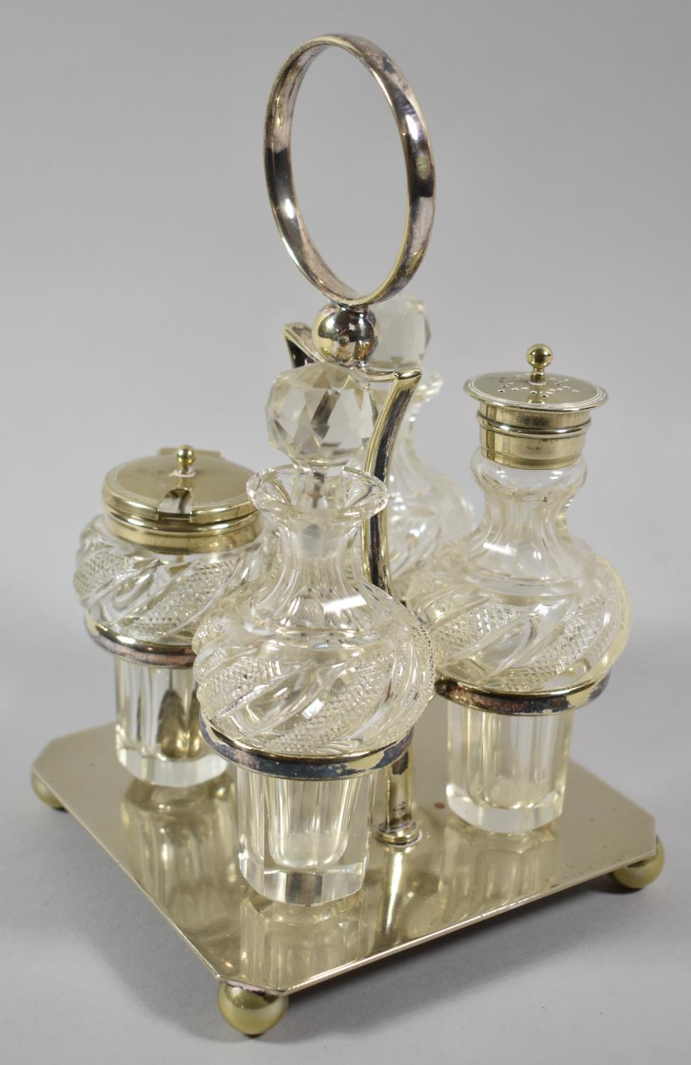 An Edwardian Four Bottle Glass Cruet Set on Silver Plated Stand, Ball Feet, 20.5cm high