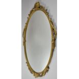 A Gilt Metal Framed Oval Wall Mirror, 66cm High