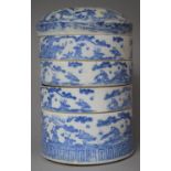 An Early 20th Chinese Porcelain Four Section Cylindrical Food Container Decorated with Children
