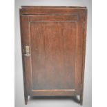 An Edwardian Oak Side Cabinet with Panelled Doors to Shelved Interior, 45cm wide
