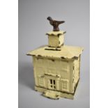 A Late 19th Century American Cast Iron Novelty Money Box in the Form of a Bank with Bird Finial,