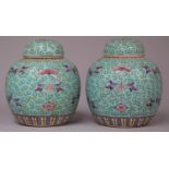 A Pair of 20th Century Chinese Lidded Ginger Jars on Blue Ground with Applied Enamels Depicting