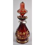 A Pretty Gilt Decorated Bohemian Cranberry Glass Octagonal Scent Box with Stopper, 15cm high
