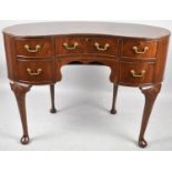 A Mid 20th Century Crossbanded Mahogany Kidney Shaped Ladies Writing Desk with Centre Drawer Flanked