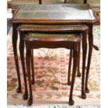 A Nest of Three Mahogany Framed Table with Tooled Leather Tops