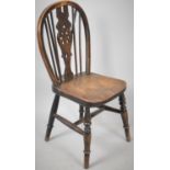 A Late 19th Century Wheel Back Child's Chair with Elm Seat