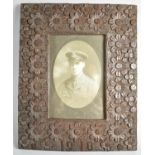 A WWI Carved Oak Photo Frame Decorated in Relief with Flowers and Dated 1918, 28x23cm