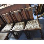 A Set of Three Oak Framed Tapestry Seated Dining Chairs