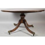 A Mid 20th Century Circular Mahogany Coffee Table on Four Supports with Brass Casters, 98cm Diameter