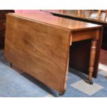 A 19th Century Mahogany Drop Leaf Rectangular Dining Table on Turned Supports, 116cm wide