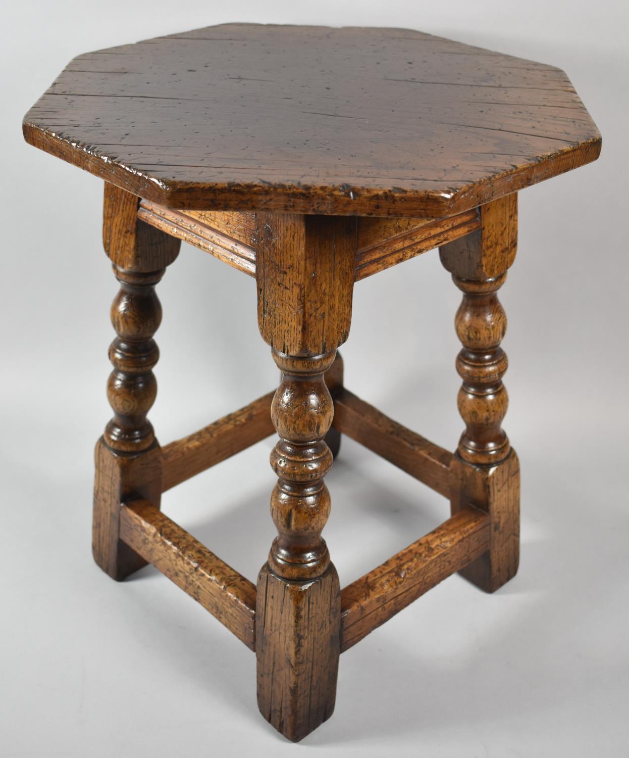 A Nice Quality Octagonal Topped Oak Small Table with Turned Supports, 38cm Diameter