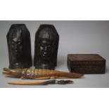 A Pair of African Ebonised Maskhead Bookends, Carved Wooden Box etc