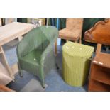 A Lloyd Loom Bow Fronted Linen Box and an Armchair