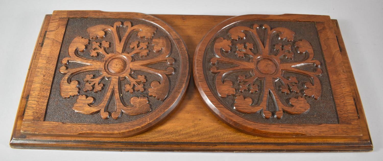 A Late Victorian Carved Book Rest with Hinged Arched End Panels, 51cm wide