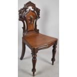 A Victorian Mahogany Serpentine Front Hall Chair with Carved Pierced Back