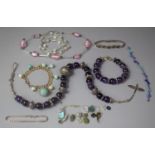 A Collection of Costume Jewellery to Include Polished Bead Necklaces and a Silver Bracelet