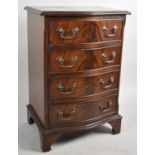 A Serpentine Front Mahogany Miniature Chest of Four Drawers, 49cm wide and 74cm high