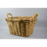 A Two Handled Wicker Log Basket, 56cm wide