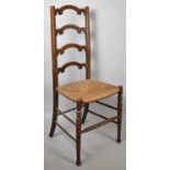 An Edwardian Rush Seated Ladder Back Side Chair