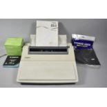 A Vintage Canon ES3 Electric Typewriter with Some Accessories