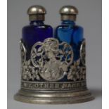 A Vintage Pierced White Metal Cylindrical Stand Containing Two Blue Glass Scent Bottles, 'A Rose