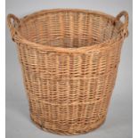 A Wicker Two Handled Log Basket, 40cm high