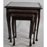 A Nest of Three Mahogany Tables