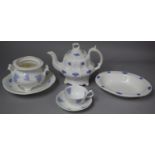 A Six Piece Teaset with Moulded Blue Floral Sprigs Decorated in Relief to Comprise Teapot, Teacup