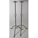 A Pair of Wrought Iron Candle Prickets on Tripod Supports, 70cm high