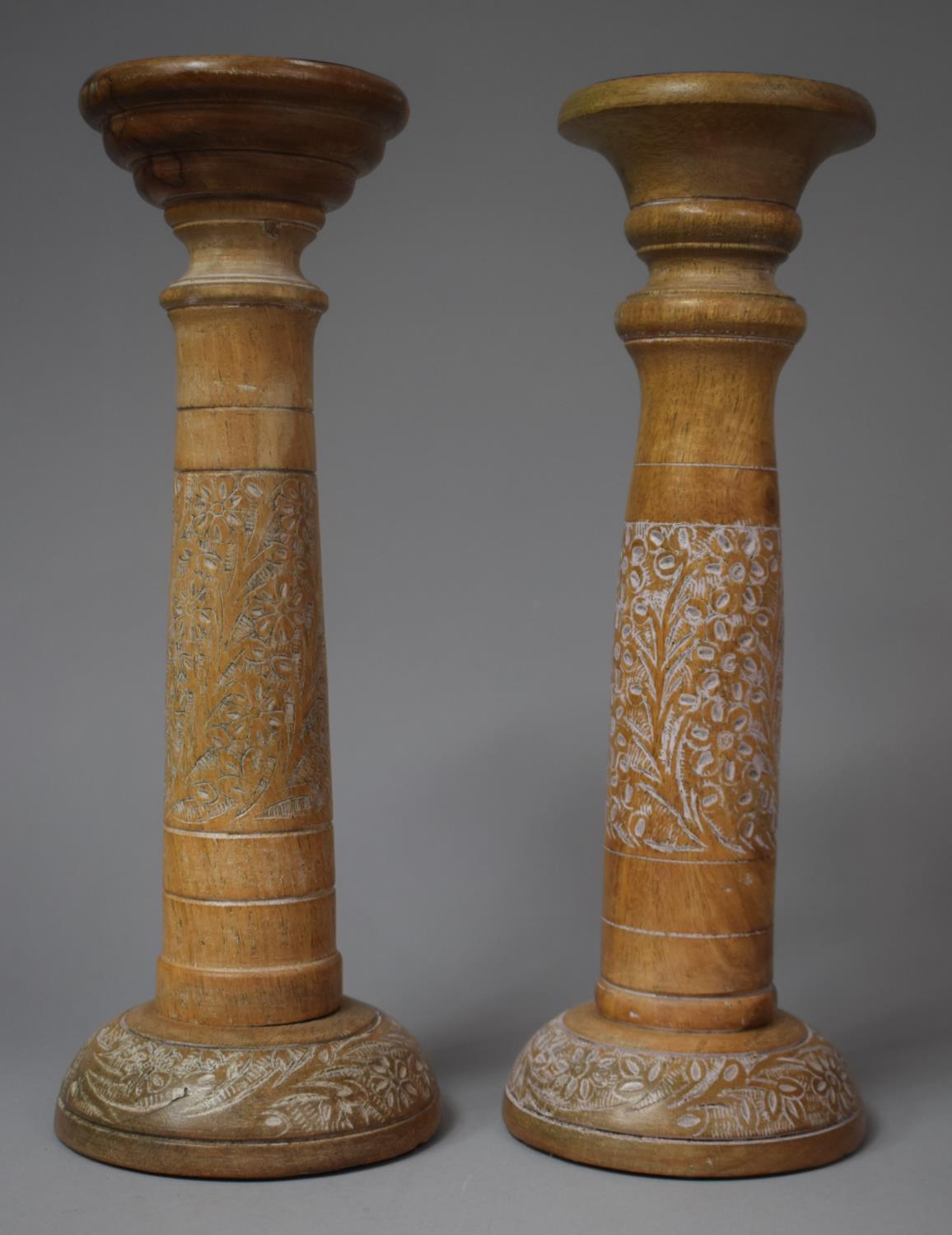 A Pair of Turned and Carved Wooden Candle Prickets, 33cm high