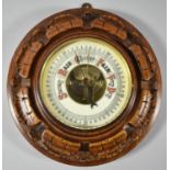 An Edwardian Wall Hanging Circular Carved Oak Aneroid Barometer, 21cm Diameter