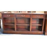 A Mid/Late 20th Century Mahogany Three Section Bookcase with Three Top Drawers, 153cm Wide and 78.