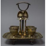 An Edwardian Pierced Silver Plated Four Cup Boiled Egg Cruet with Pierced Tray Base and Four