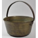 A Vintage Brass Jam Kettle with Iron Loop Handle, 28cm Diameter